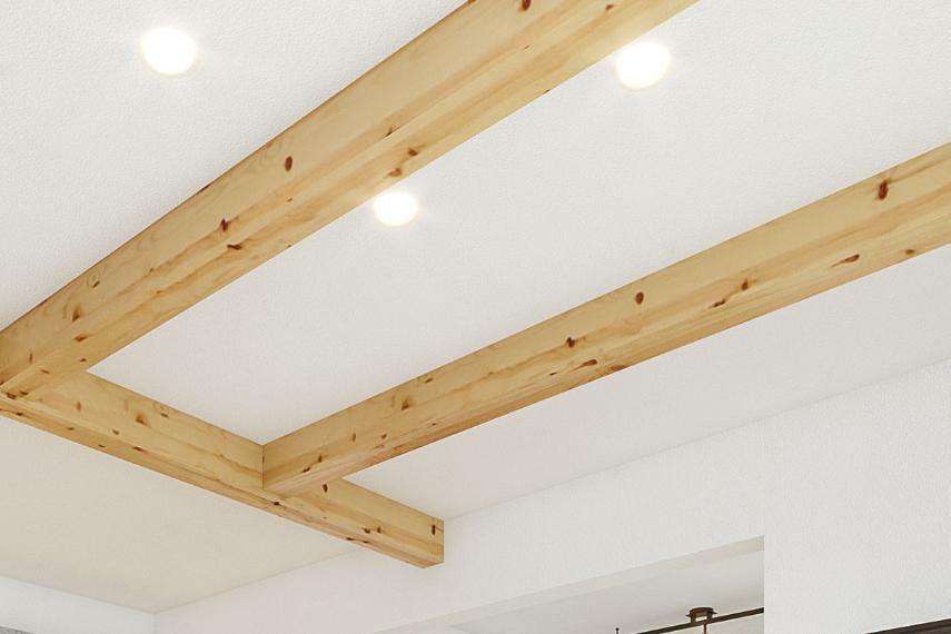 居間・リビング 【天井から温もりを伝える化粧梁】  木の持つ上品な温かさがアクセントを添え、おしゃれに空間を飾っています。天井面に凹凸ができることで奥行きが生まれます。※号棟ごとにカラーは異なります。